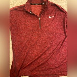 Nike red performance pull over; size medium.